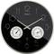 Analog wall clock with a black face showing the time at approximately 10:09. Includes humidity and temperature gauges below the hands.