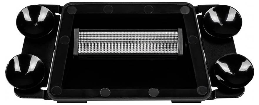 A black rectangular shaving head with four rounded attachments for securing, designed for smooth and precise grooming.