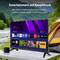 'A TV next to a camping scene displays a streaming service interface with various apps and shows, emphasizing on-demand entertainment.'