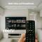 'A hand holding a remote control in front of a TV screen; the screen displays various thumbnails. Text at the top reads: Mehr Infos auf Knopfdruck.'