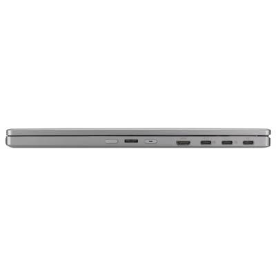 A closed silver laptop viewed from the side, displaying various ports and connectors.