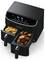 Dual-basket air fryer with fries in one basket and wings in the other, displaying digital controls at the top.