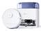 A white robotic vacuum cleaner next to its docking station. The vacuum is designed for automated floor cleaning, featuring a sleek, modern design.