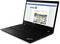 A black laptop open at an angle, displaying an email with text and an image of a boat under construction on the screen.