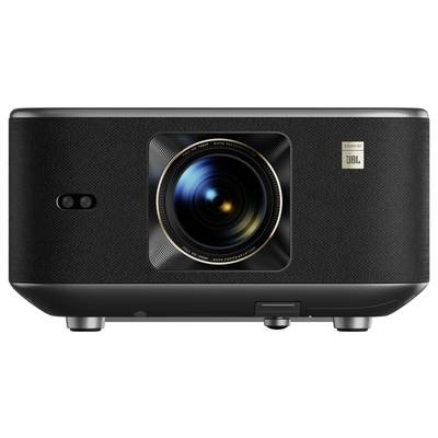 A black projector with a prominent lens in the center, featuring a small 'JBL' logo on the upper right corner, indicating audio enhancement.
