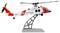 A model of a U.S. Coast Guard helicopter on a stand, featuring a red and white design with visible details like rotor blades and decals.
