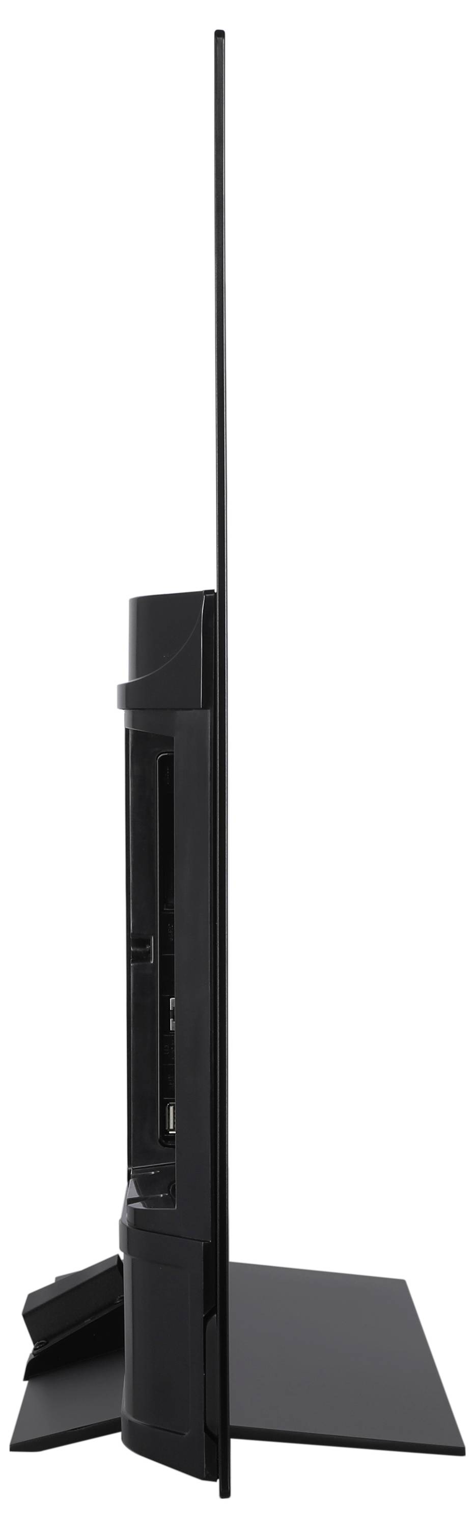 Side view of an ultra-thin flat screen television on a stand, showcasing its sleek and slim profile.