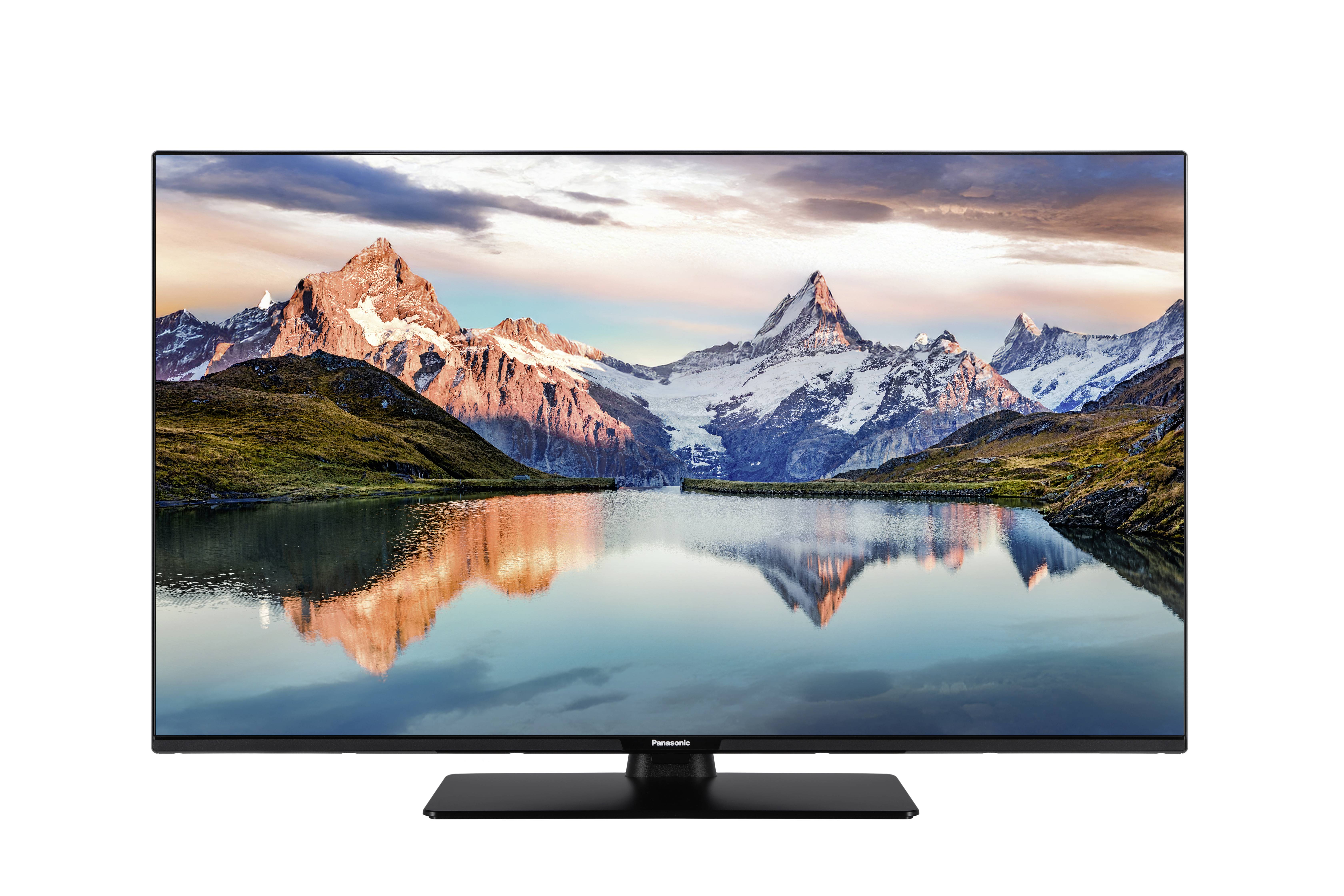 The image shows the back view of a black flat-screen television with its stand attached.