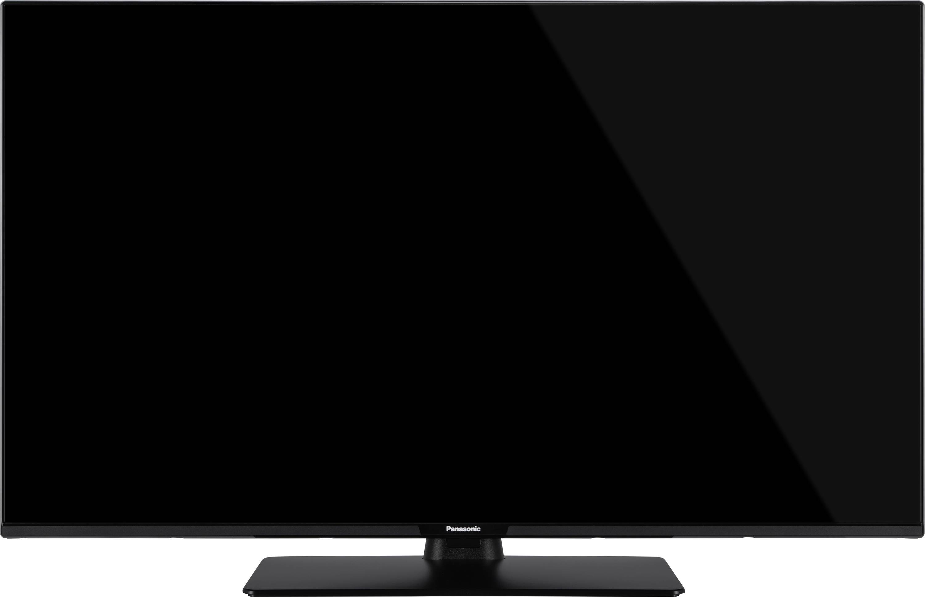 A black flat-screen television on a rectangular stand against a white background.