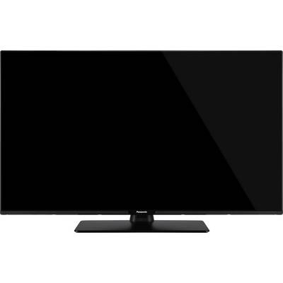 A black flat-screen television on a rectangular stand against a white background.