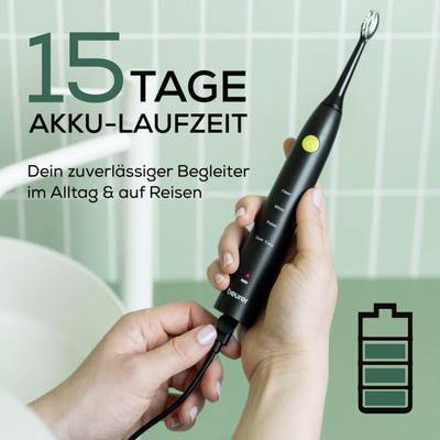 A hand holding a black electric toothbrush with a green power button, next to text indicating a 15-day battery life and a battery icon.
