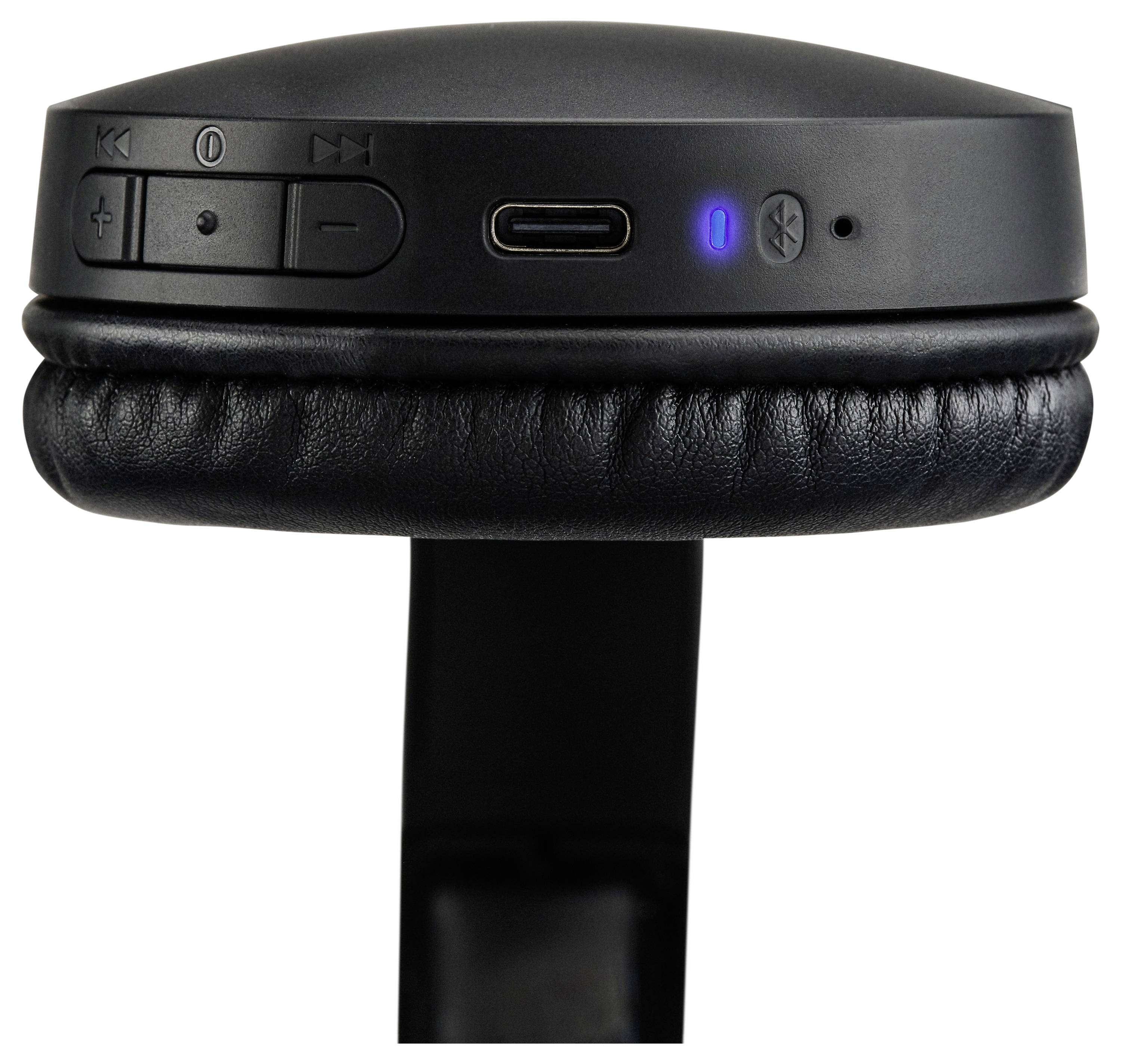 Close-up of black over-ear headphones showing control buttons and a blue Bluetooth indicator light on the side of the ear cup.