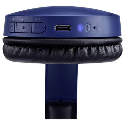 Blue wireless headphones showing control buttons and charging port on the side of one ear cup, with a leather cushion visible.