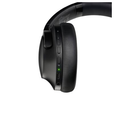 Black over-ear headphones showing volume control, noise-canceling switch, and charging port on the right ear cup.