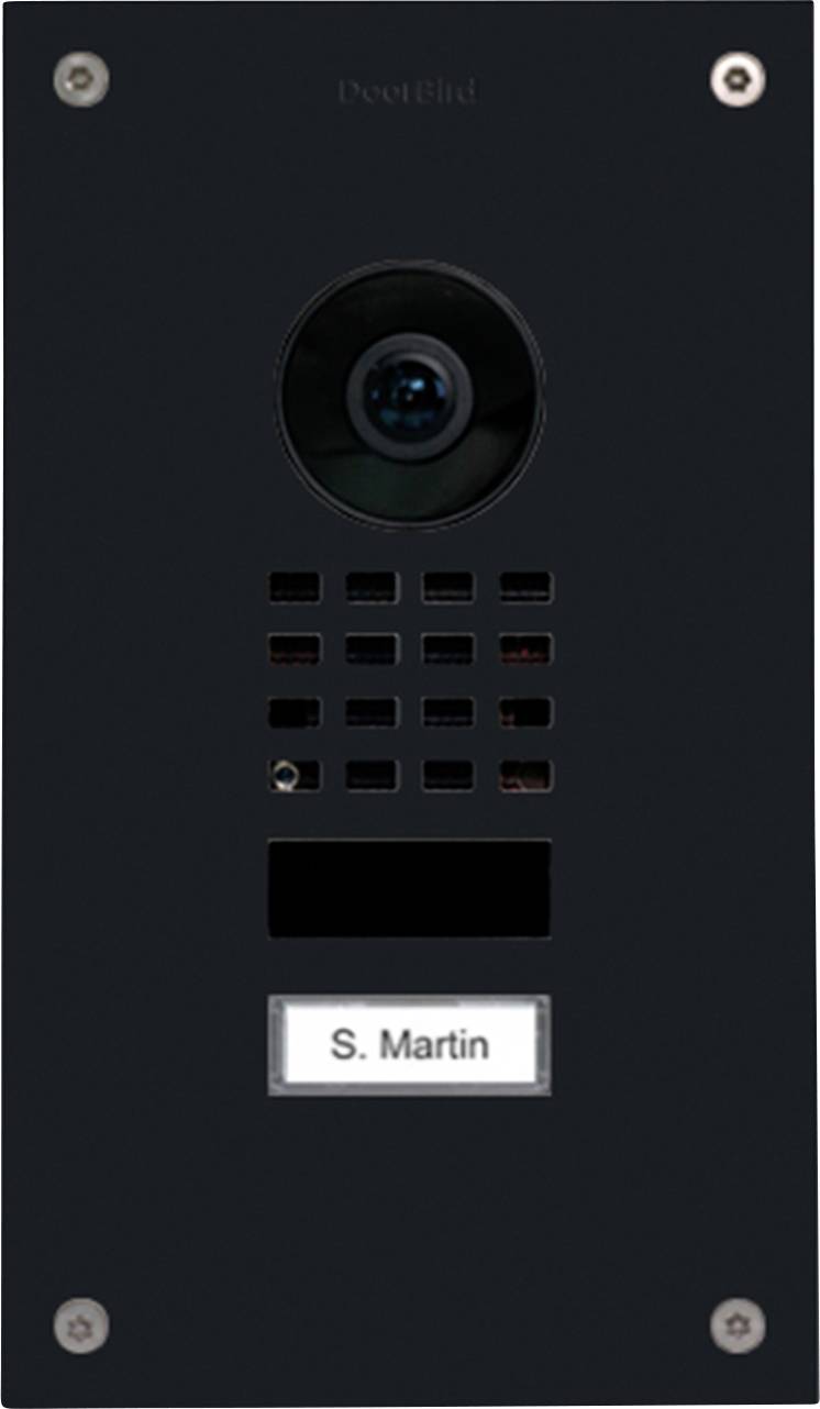 'DoorBird' intercom panel with a camera lens and speaker grid. A nameplate reads 'S. Martin.'