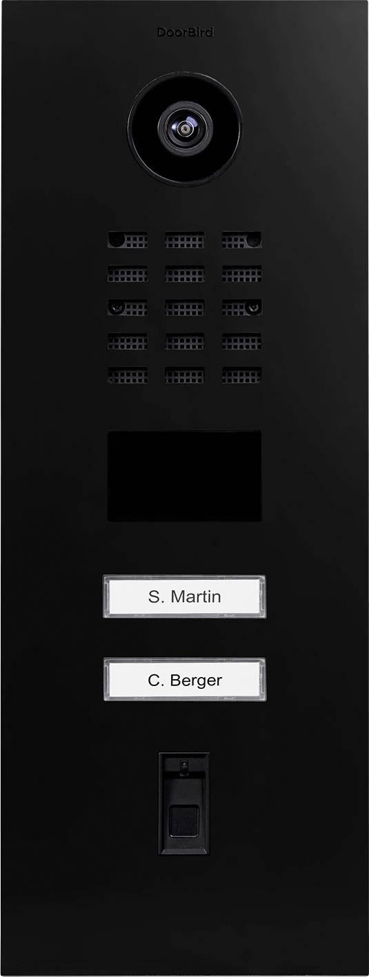 A black video door intercom with a camera, speaker, nameplates reading 'S. Martin' and 'C. Berger', and a button below the nameplates.