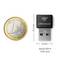 'devolo WiFi 6 Stick nano' USB adapter next to a 1 euro coin. The adapter measures 25.5 mm by 16 mm.