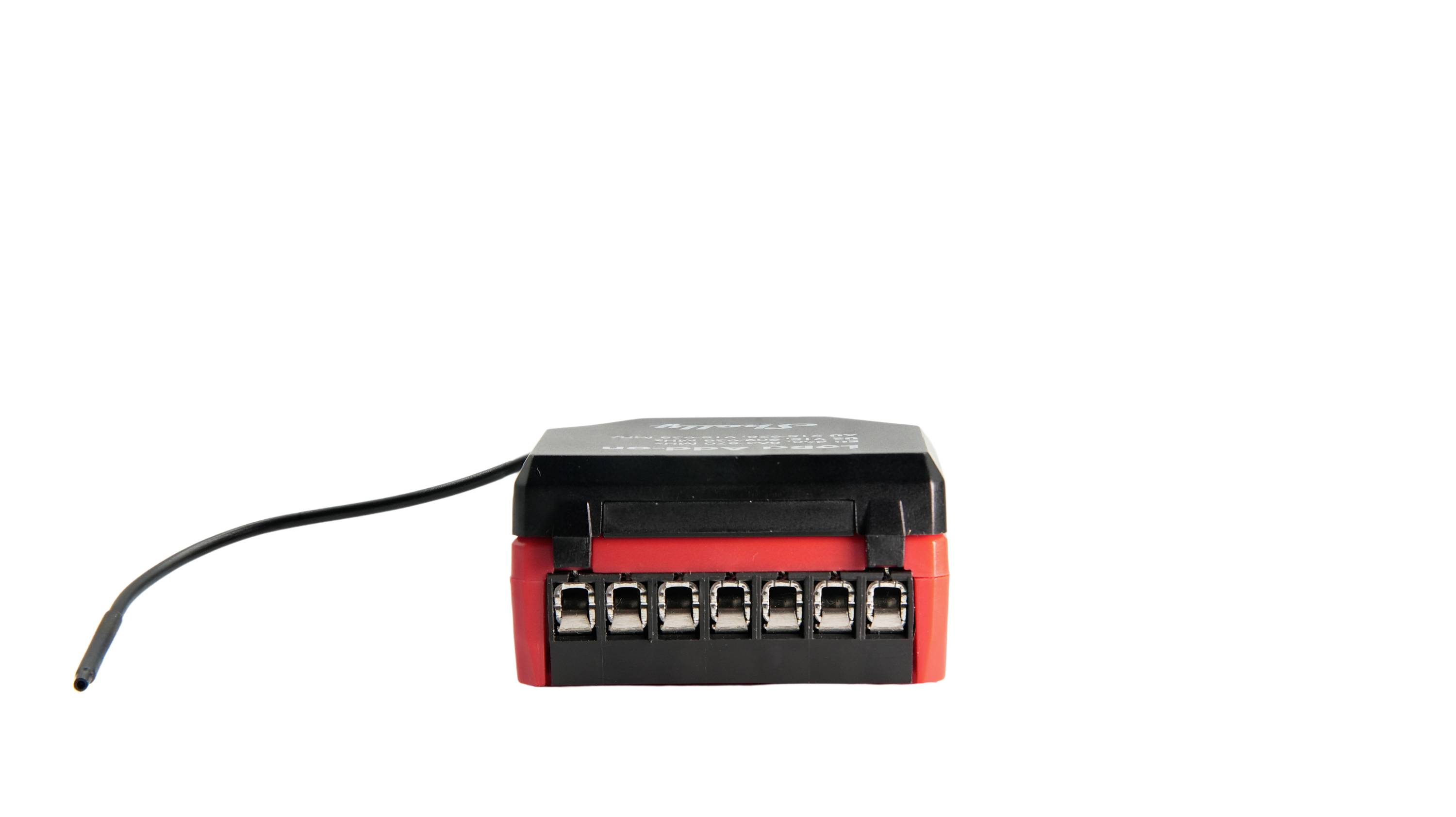 'A rectangular black and red electronic device with multiple connector ports and a single black wire extending from one end.'