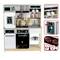 Child's play kitchen set with appliances including oven, microwave, fridge, and stove. Shelves hold dishes and accessories.