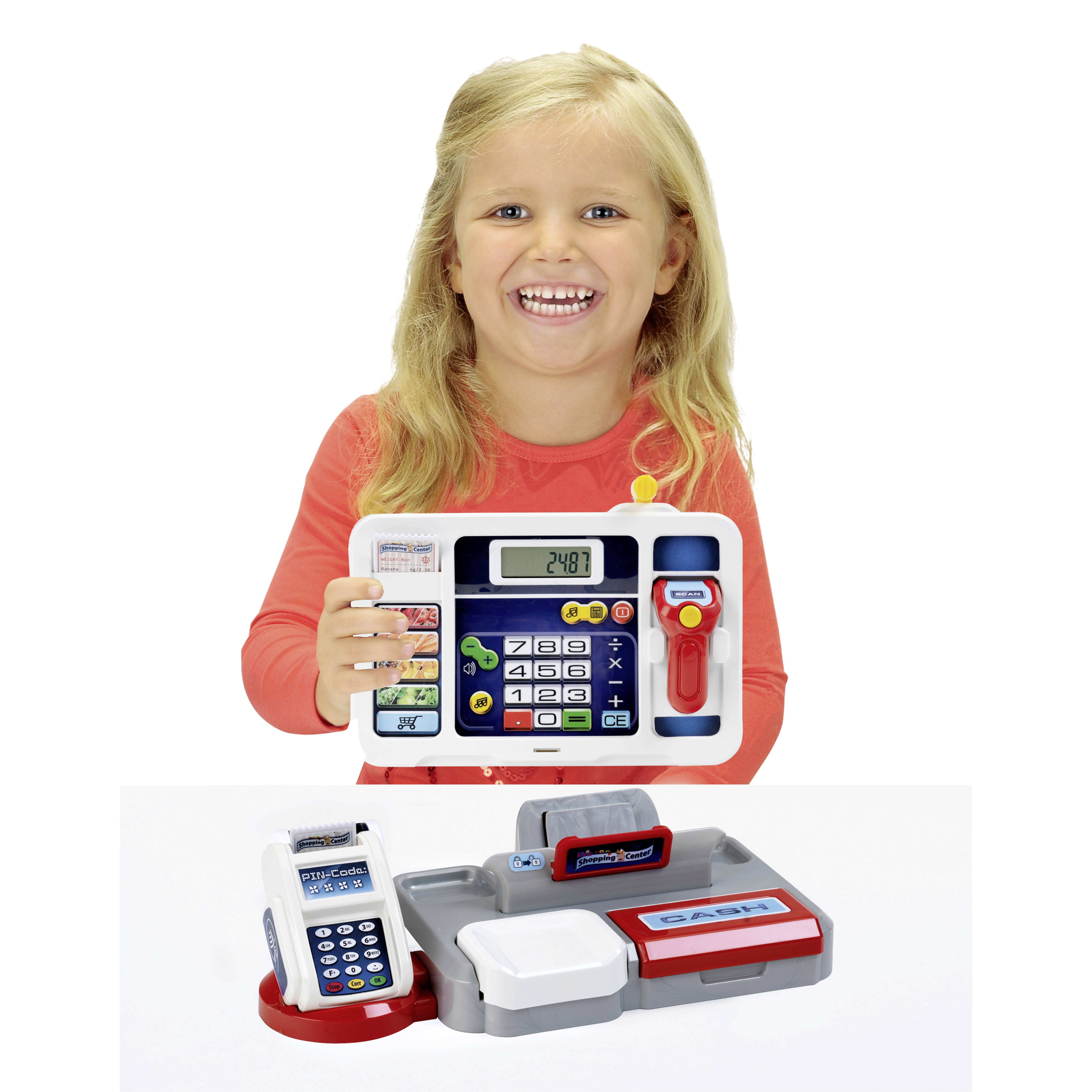 A smiling child holds a toy cash register set, featuring large buttons and a card reader, promoting interactive play and learning.