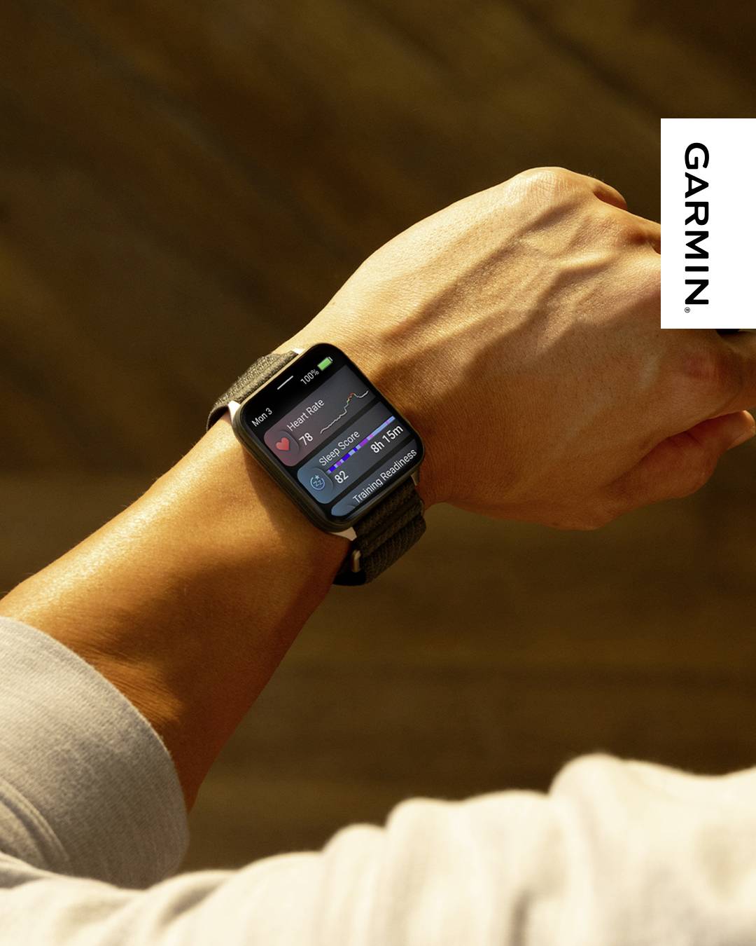 A person checks fitness stats on a smartwatch, showing heart rate and calories. Garmin logo is visible.