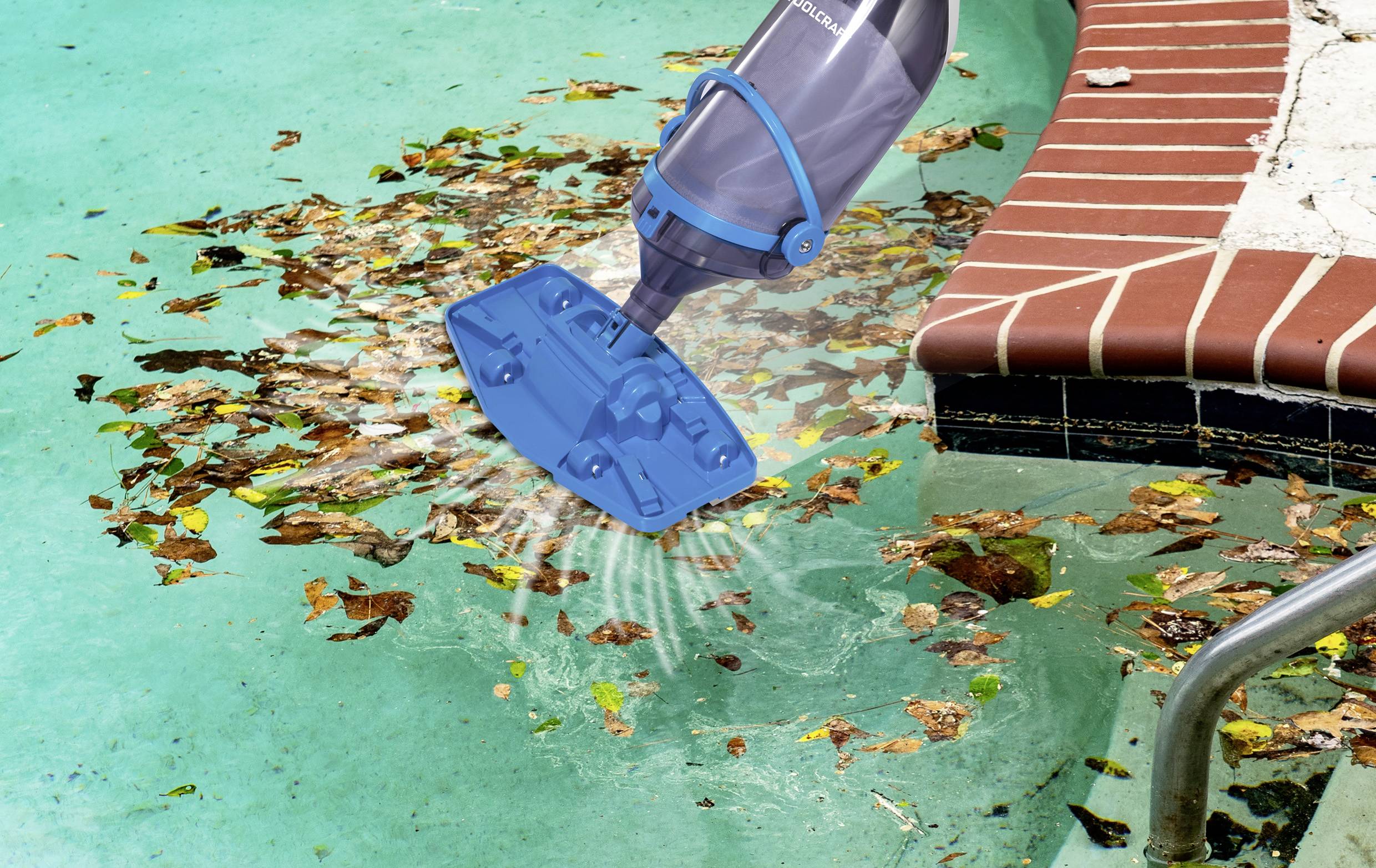 'A pool vacuum cleaner is shown suctioning leaves from a swimming pool, next to a brick-lined edge, demonstrating cleaning action.'
