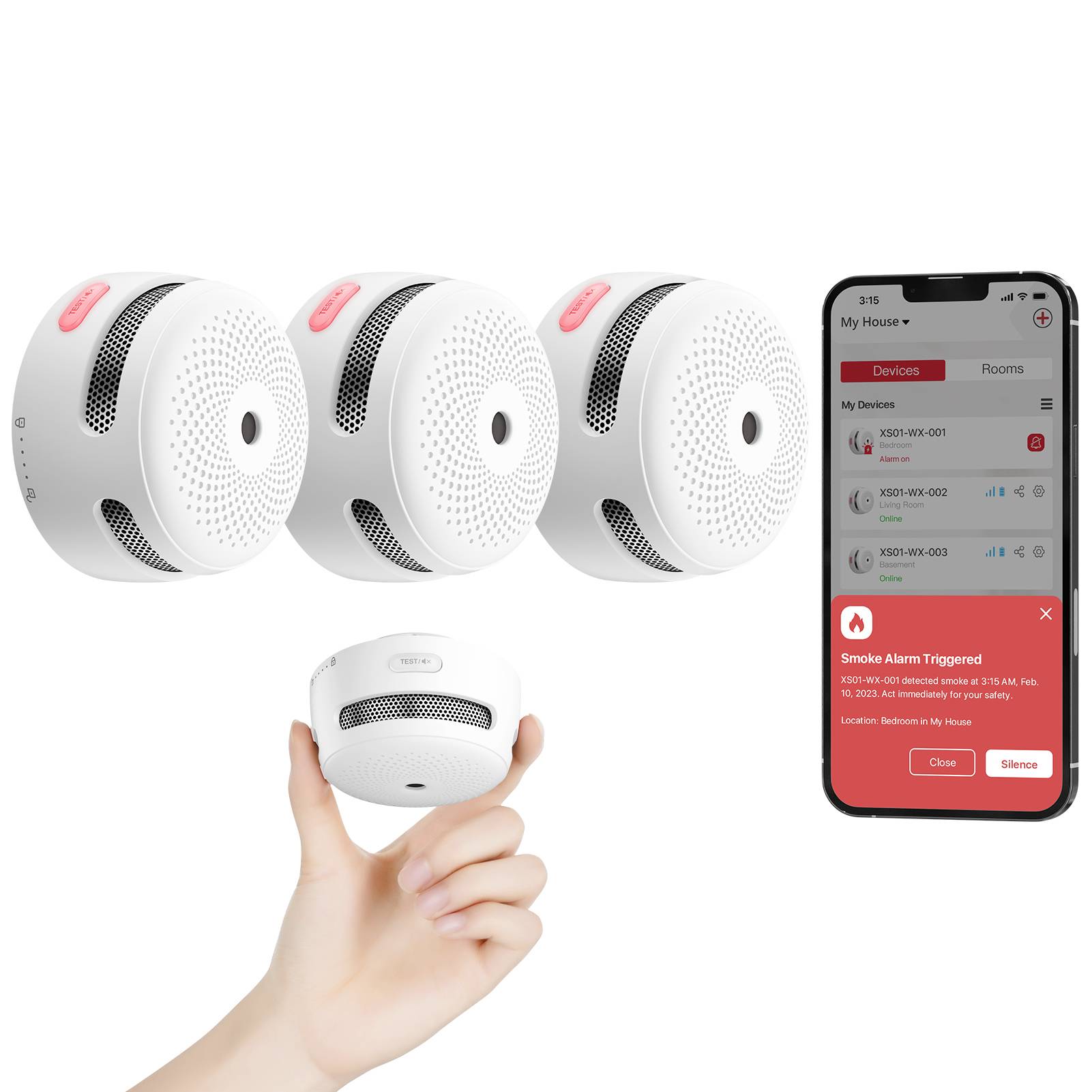 A hand holds a white smoke detector. Nearby, three identical detectors, and a smartphone showing an app alert 'Smoke Alarm Triggered'.