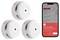 Three white smoke detectors with a red alert button. A smartphone screen shows a triggered smoke alarm notification for a bedroom.