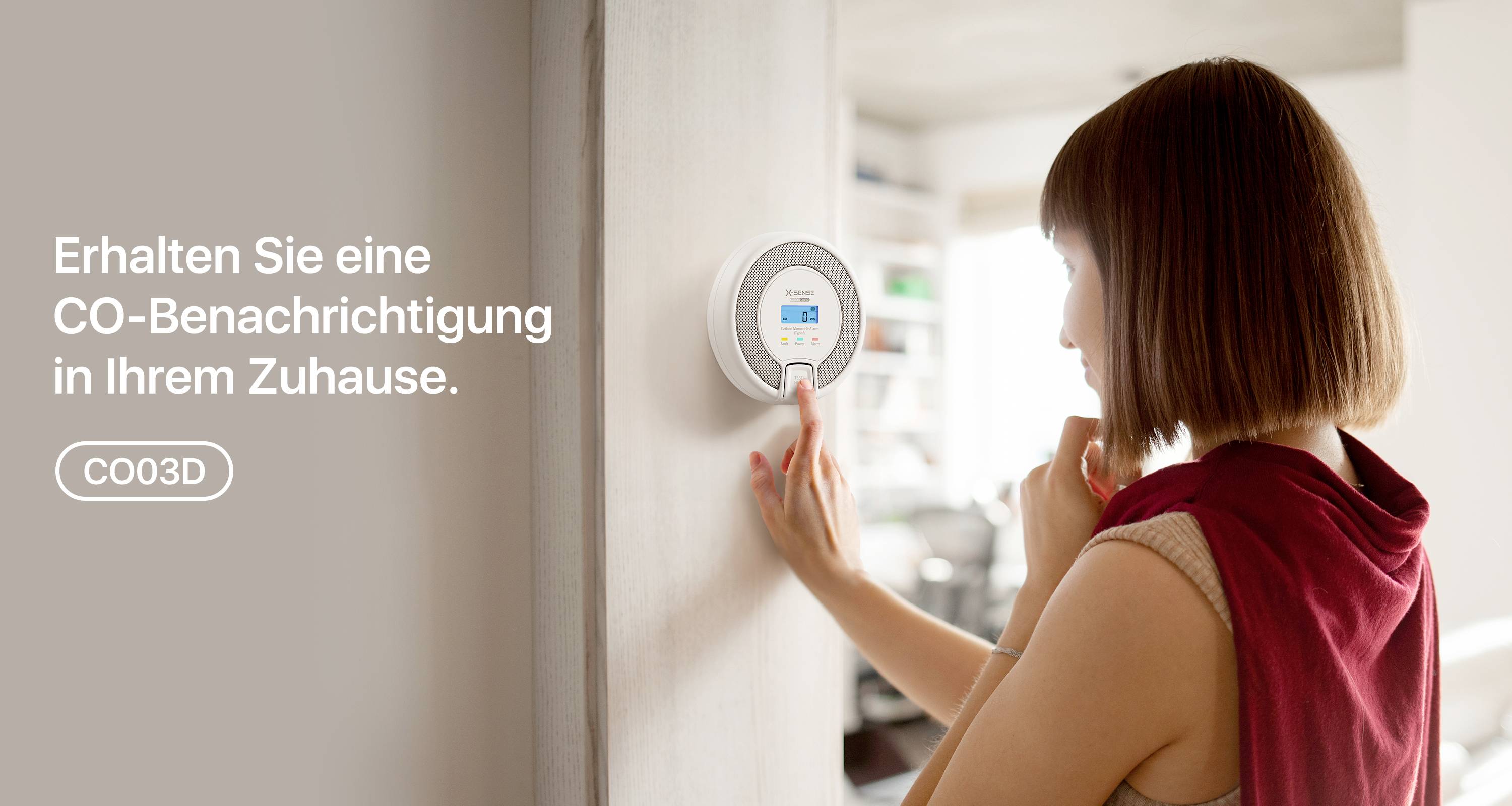 A person is operating a smart, wall-mounted thermostat in a modern room. Text: 'Get a CO notification in your home.'