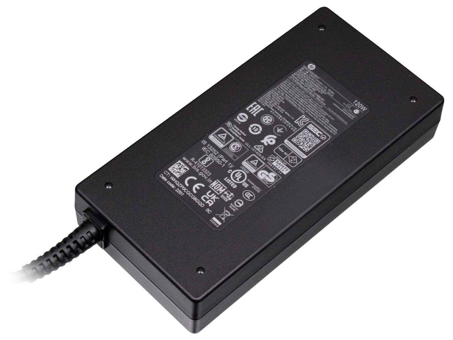 A black power adapter with a cable extending from it, featuring various technical symbols and specifications printed on the top surface.