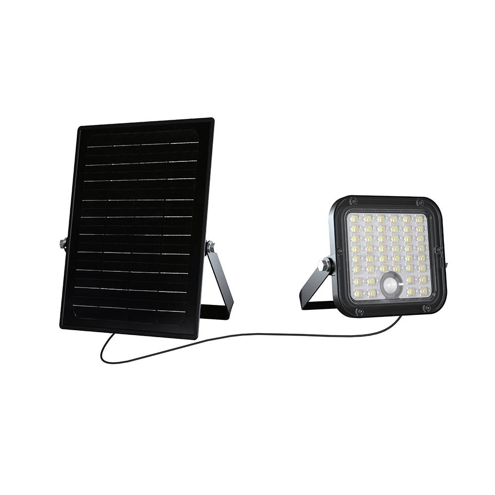 A solar-powered LED floodlight with a separate solar panel. The floodlight is connected to the panel by a cable, indicating outdoor usage.