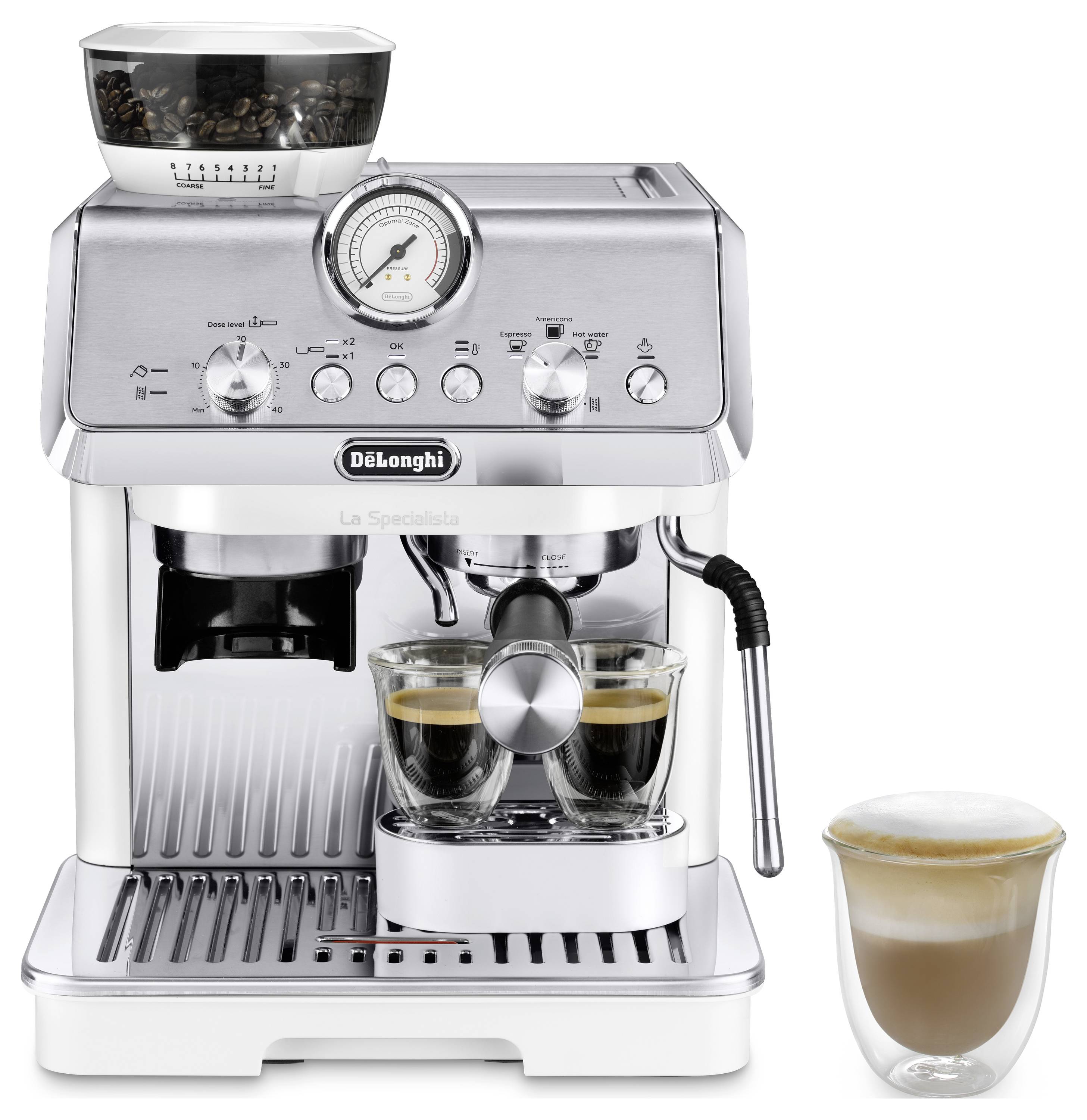 A silver espresso machine with a pressure gauge, making two cups of coffee. A cup of frothed milk is on the side.