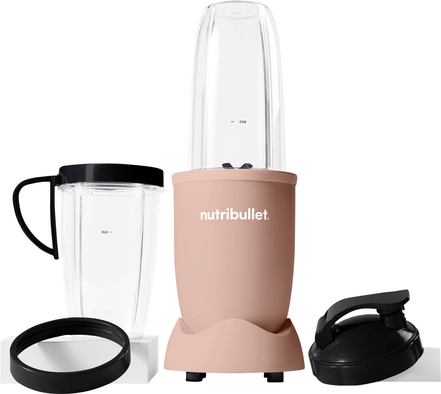 A pink Nutribullet blender with a blending cup, an additional cup with handle, lid, and blending blade, arranged side by side.