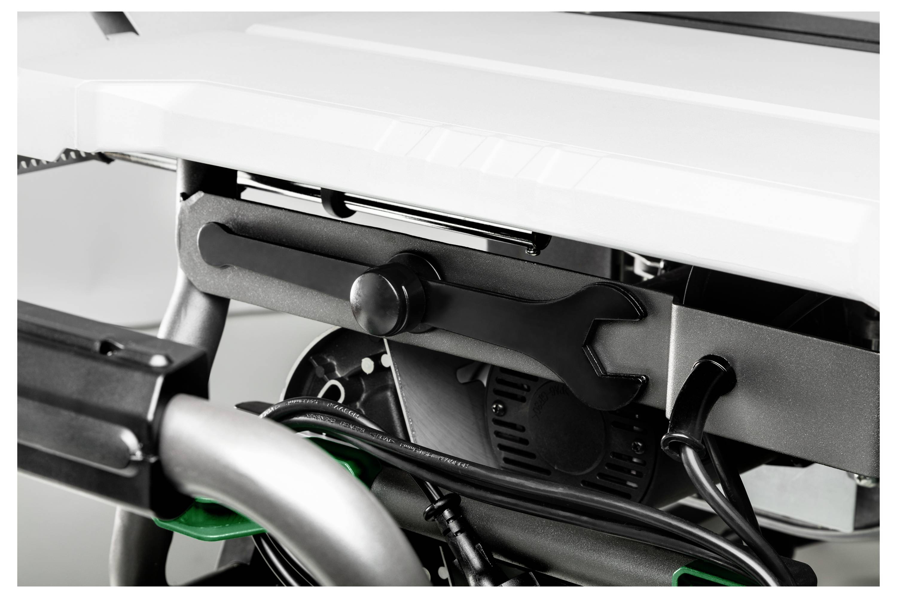 Close-up of a mechanical device with a wrench attached, showcasing intricate parts and wires, suggesting functionality and assembly.