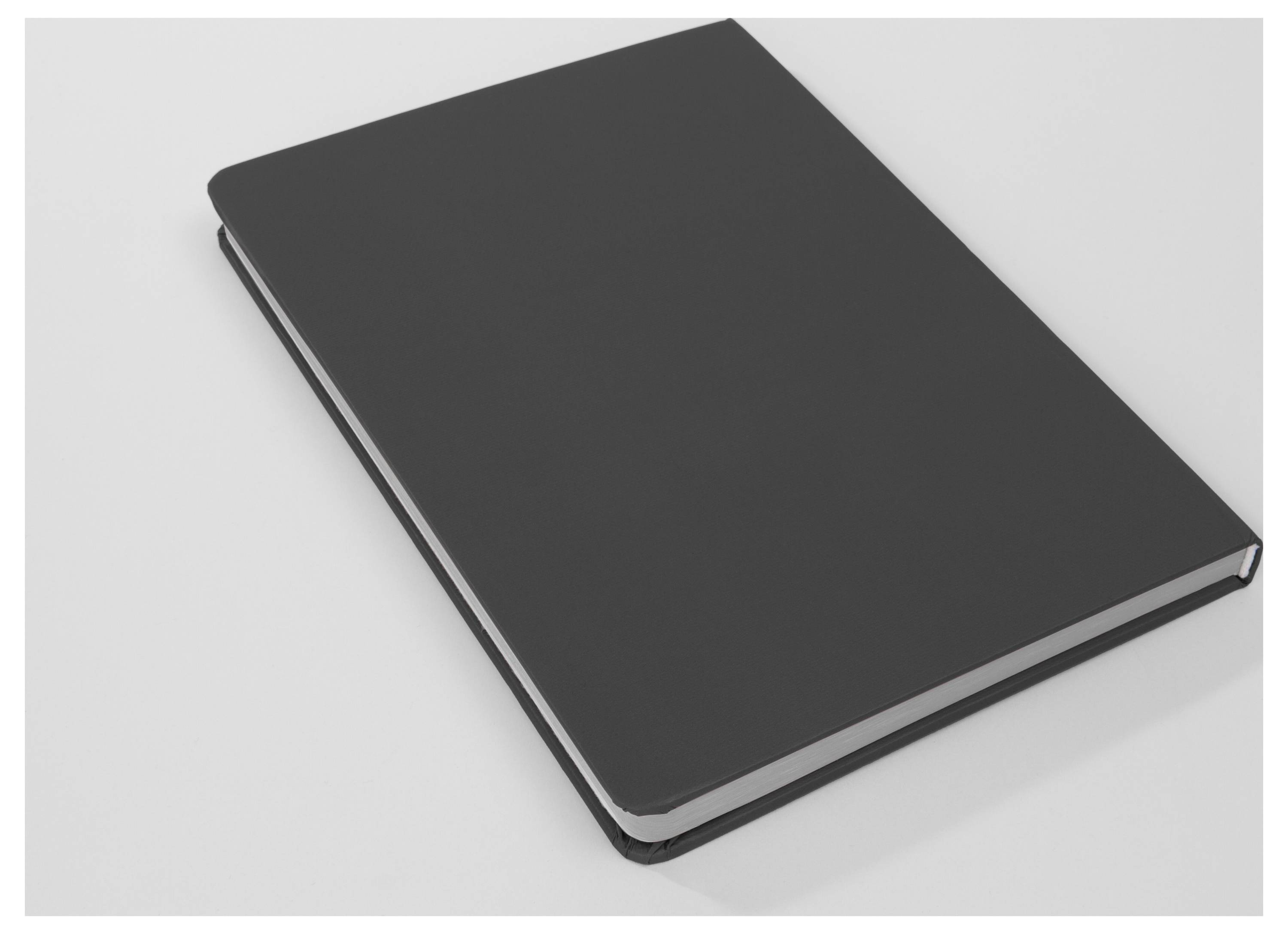 Closed black hardcover notebook on a light gray background, viewed from above at an angle.