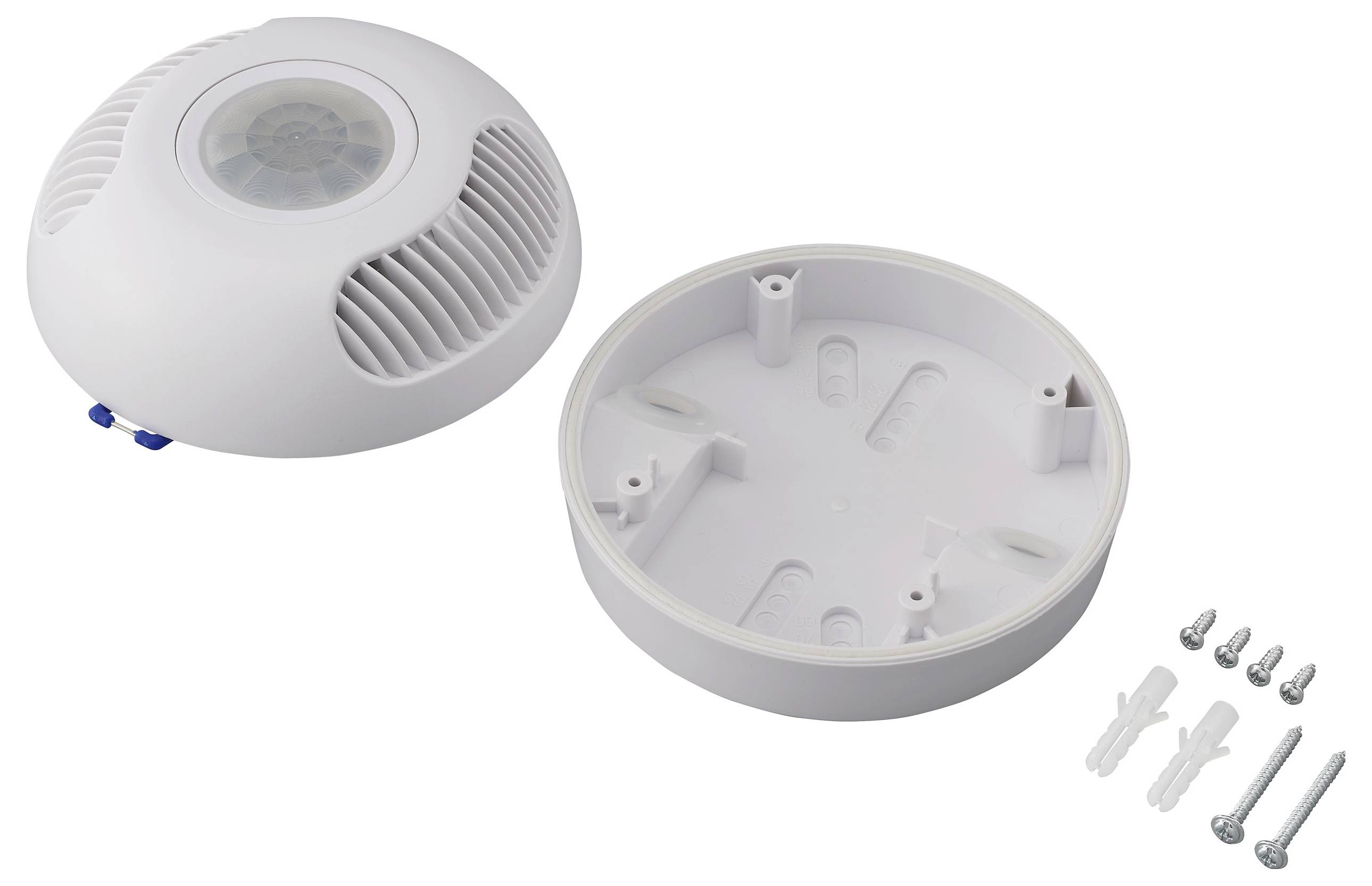 A ceiling-mounted motion sensor with its base plate detached, accompanied by screws and anchors for installation.