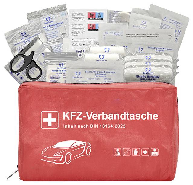 Red first aid kit bag with various medical supplies including bandages, adhesive plasters, and scissors labeled 'KFZ-Verbandtasche'.