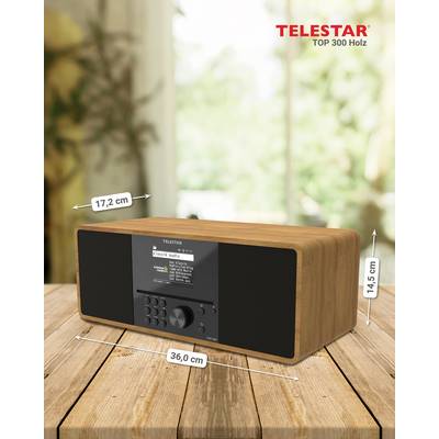 Wooden radio by Telestar with dimensions: width 36 cm, depth 17.2 cm, height 14.5 cm. Placed on a table against a blurred background.