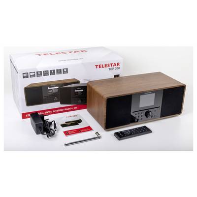 A Telestar Top 300 radio set with box, power adapter, remote, antenna, and manuals. The radio features internet radio and CD capabilities.
