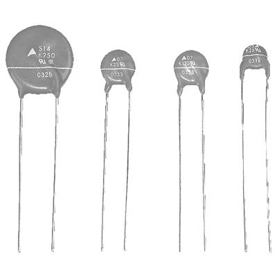 'Varistors with various voltage ratings and sizes arranged from left to right; electronic components used for voltage surge protection.'