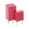 Two red WIMA capacitors with labeled values of '3.3μ' and '63.' They have metallic leads for circuit board mounting.