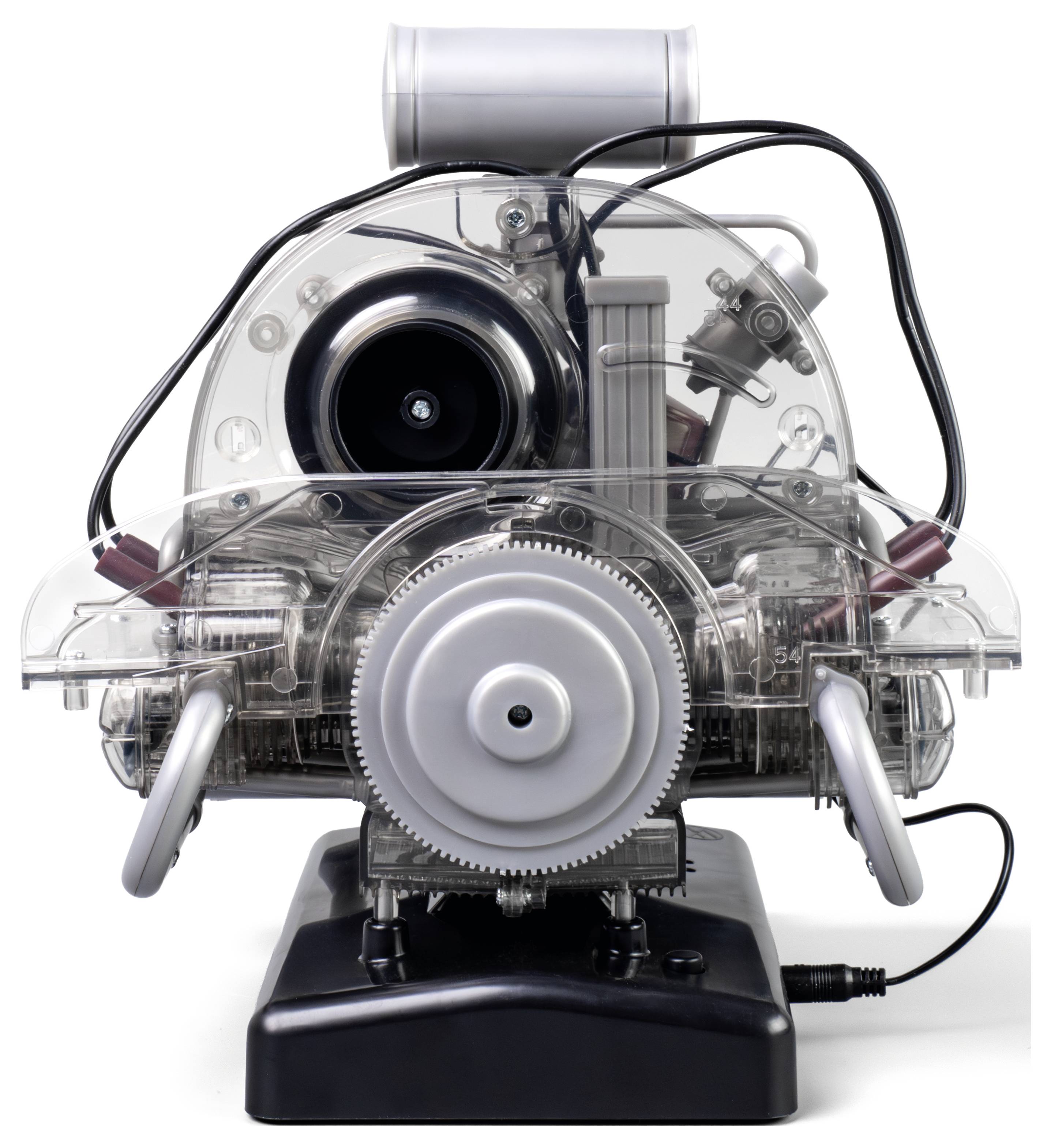 A transparent model of a rotary engine displaying internal gears and components, connected to wires, on a black base.