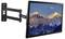 A wall-mounted TV with an adjustable arm showing a scenic image of snow-capped mountains under a partly cloudy sky.