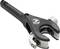 'A black and silver pipe cutter with an ergonomic handle and rotary cutting mechanism, used for cutting pipes cleanly and efficiently.'
