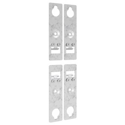 Four metal wall brackets with holes and slots for mounting, arranged in two vertical pairs. Each bracket has a unique configuration.