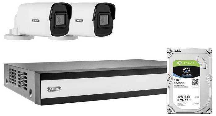 Two security cameras and a recording device are shown with a 1TB Seagate hard drive.