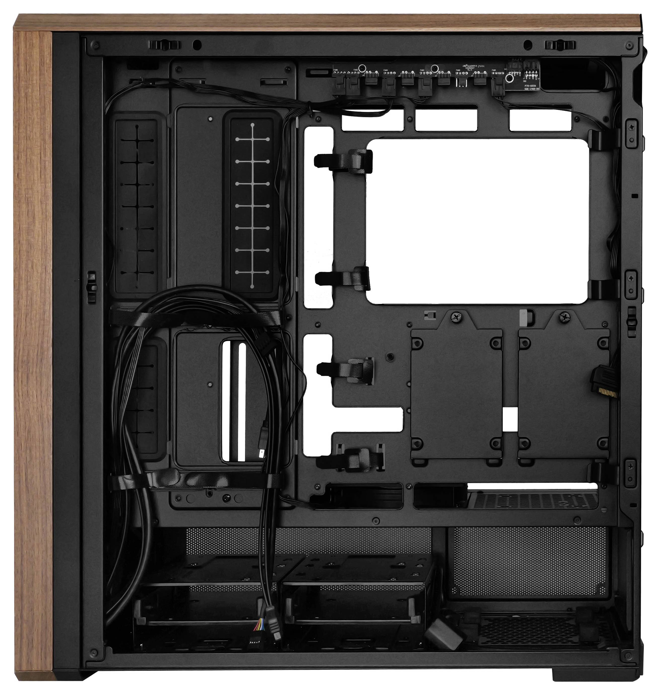 Computer case interior, showing cable management channels, drive bays, and motherboard mounting area. No components installed.