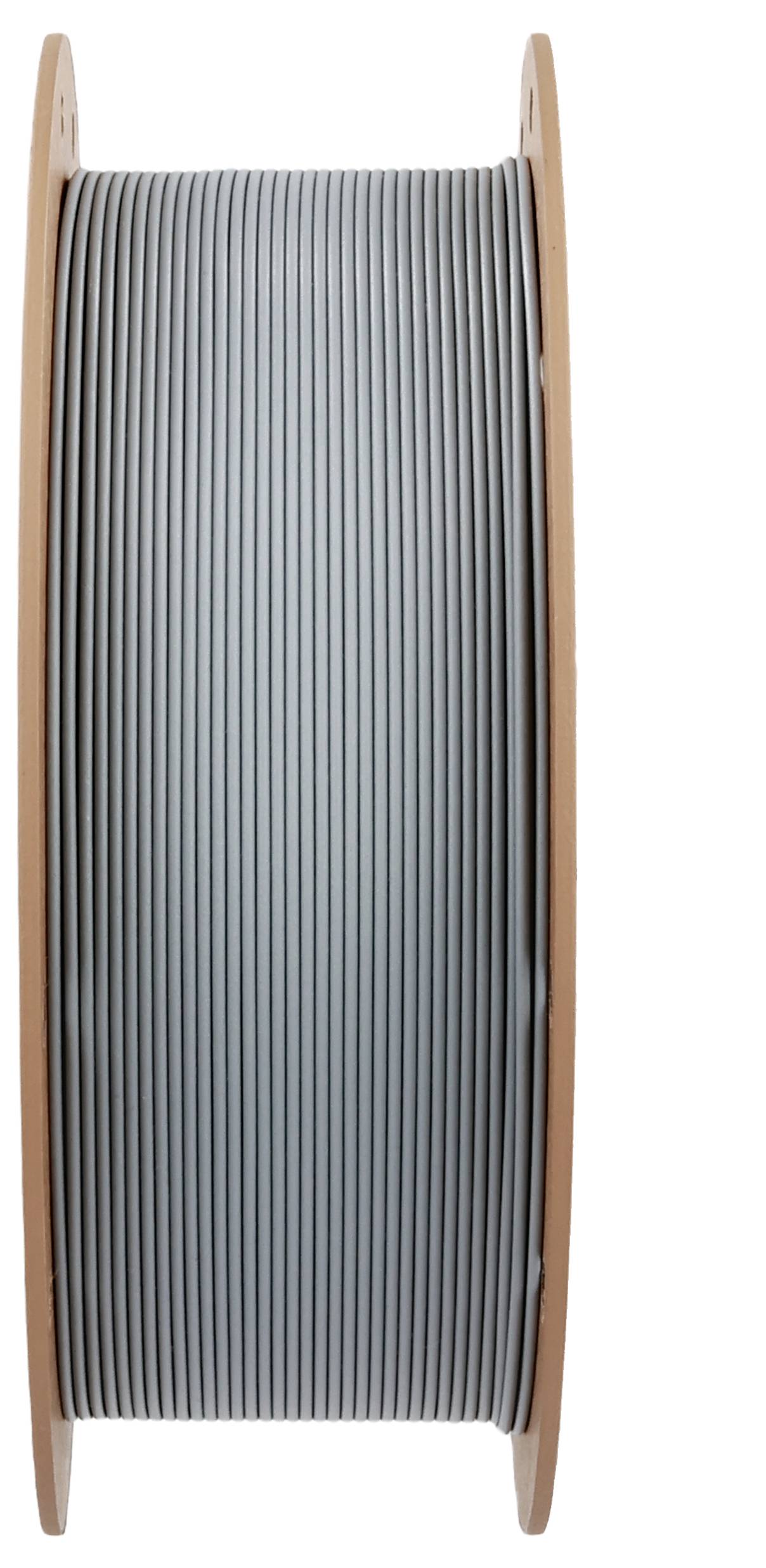 A large spool of silver wire is shown upright, with a wooden frame supporting it. The wire is tightly wound around the spool.