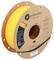 A spool of yellow Polymaker 3D printing filament labeled 'Power Tool Yellow' with QR code and compatibility information for materials.