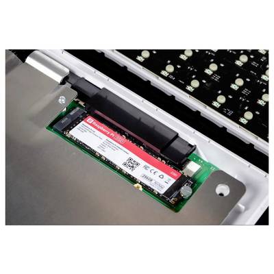 A close-up of an NVMe SSD installed in a computer. The SSD label reads 'Kingston FURY' with visible interface and part of the motherboard.